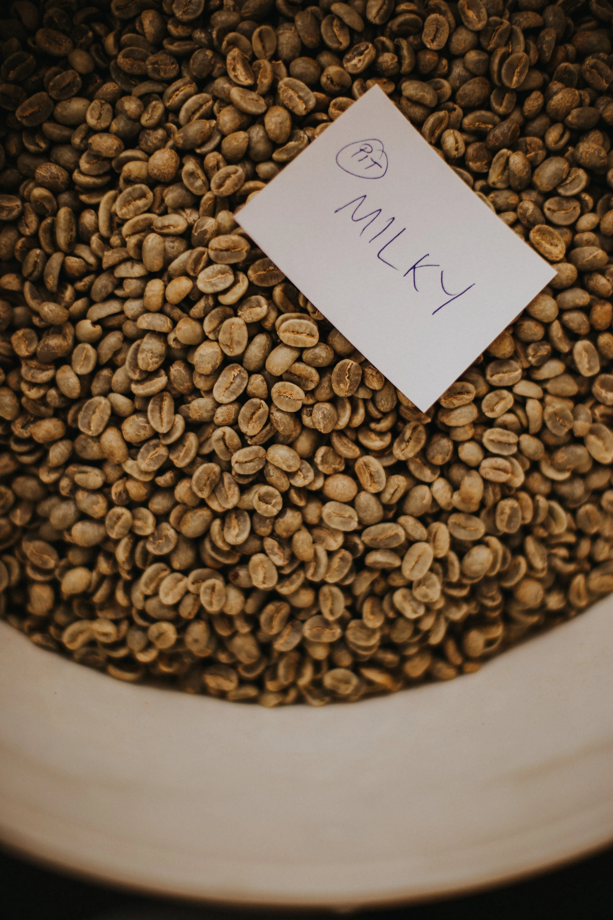 Hand sourced green coffee beans with blend name